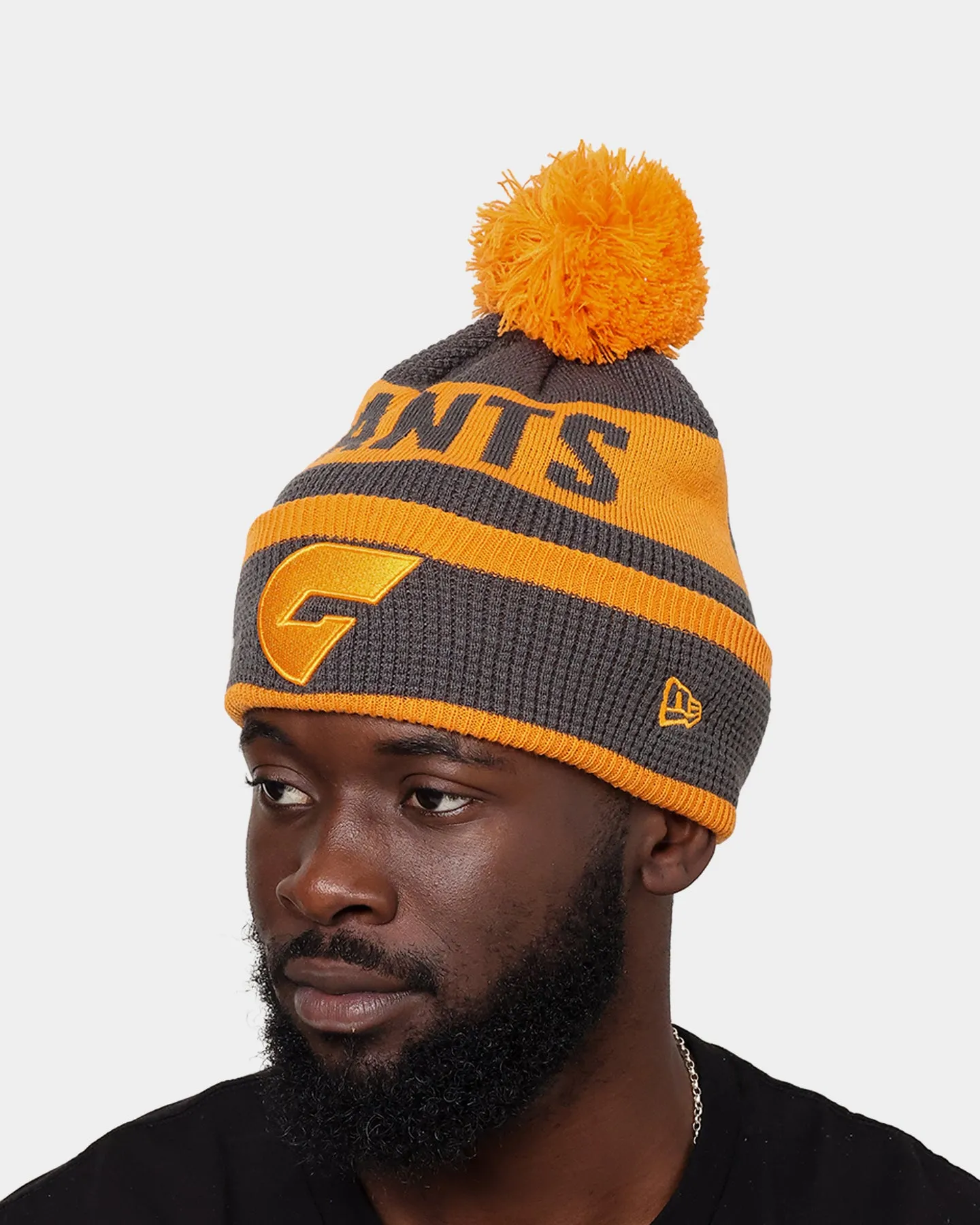 New Era Greater Western Sydney Giants AFL Opening Bounce 2022 Pom Waffle Wordmark Beanie Dark Grey/Orange