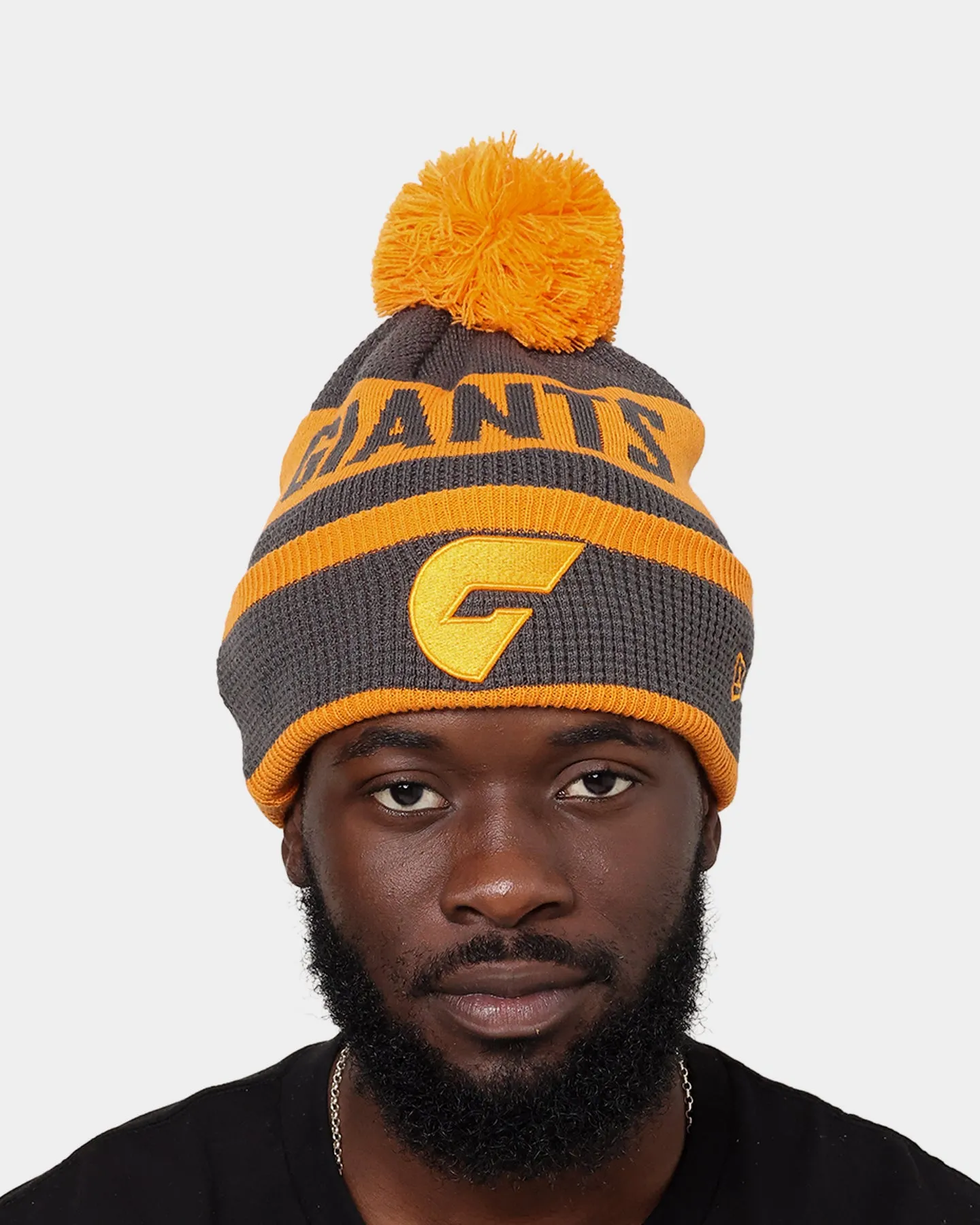 New Era Greater Western Sydney Giants AFL Opening Bounce 2022 Pom Waffle Wordmark Beanie Dark Grey/Orange