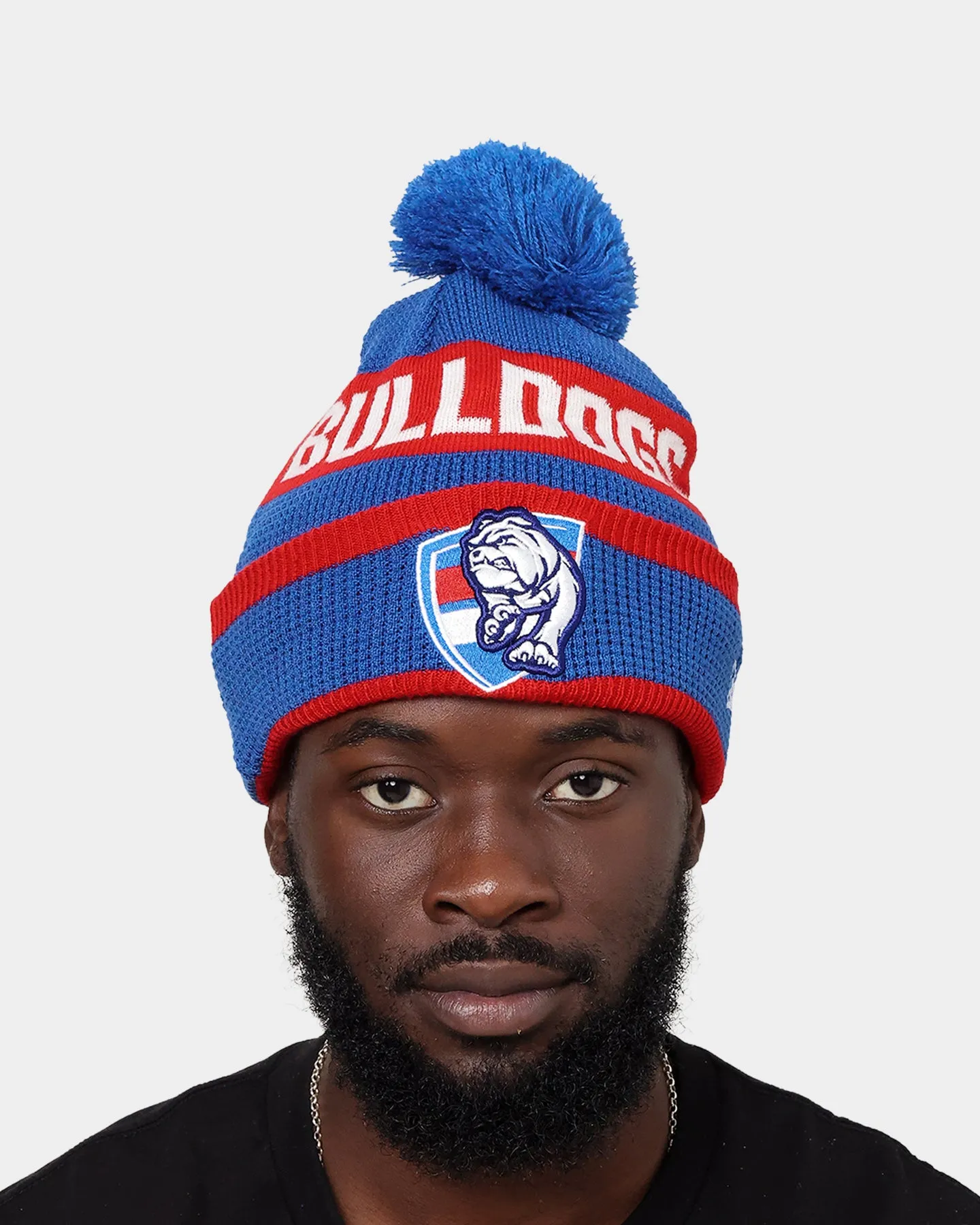 New Era Western Bulldogs AFL Opening Bounce 2022 Pom Waffle Wordmark Beanie Blue